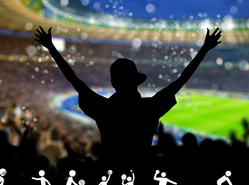 ein Siluette eines Menschen der die Arme in die Luft streckt im Hintergrund ein unscharfes Stadionumfeld/ Spielfeld am unteren Rand Piktogramme von verschiedenen Sportarten